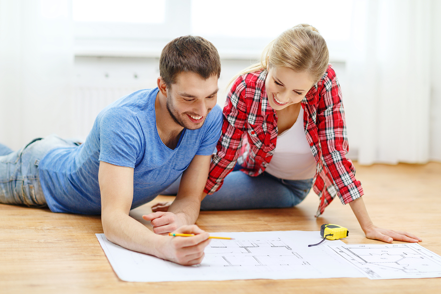 repair, building, renovation and home concept - smiling couple l